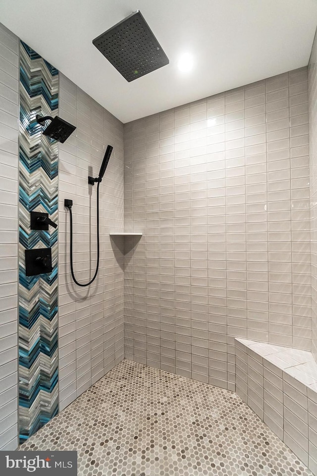 bathroom with a tile shower