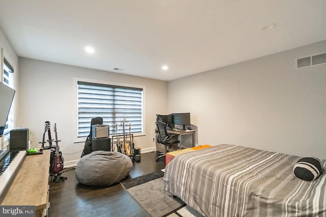 bedroom with hardwood / wood-style floors