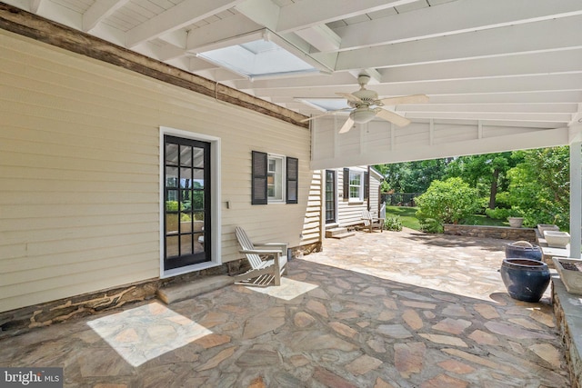 view of patio featuring ceiling fan