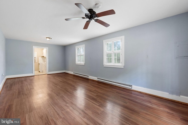 unfurnished room featuring ceiling fan, dark hardwood / wood-style flooring, and a baseboard heating unit