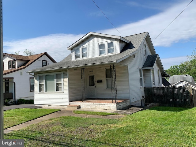 view of front of home featuring a front yard and a porch