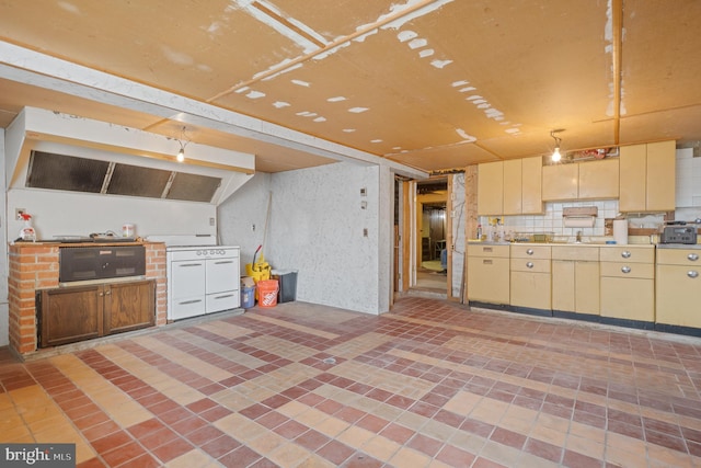 1722 Selma Ave, Halethorpe, MD 21227 - kitchen with decorative backsplash, cream cabinets, and light countertops
