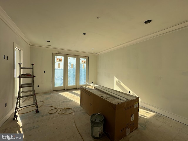 game room with crown molding and french doors