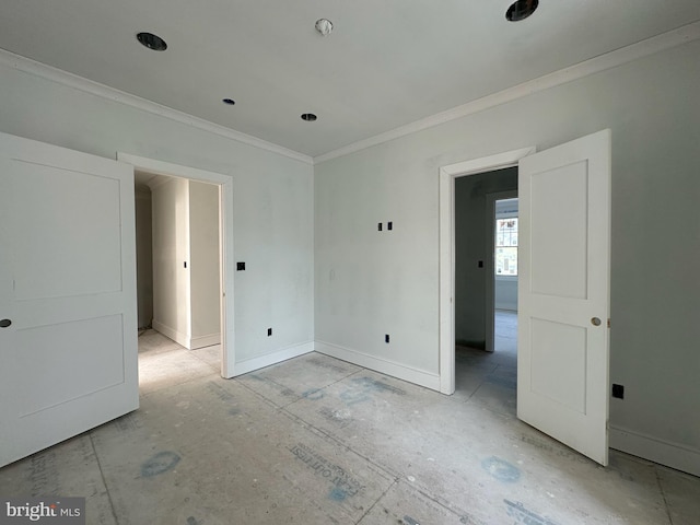 spare room with crown molding