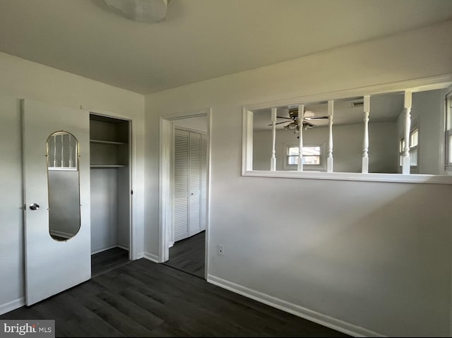 unfurnished bedroom with dark wood-type flooring