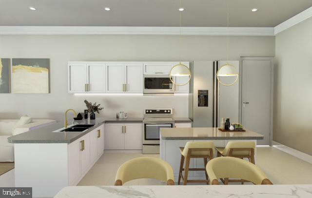 kitchen with pendant lighting, kitchen peninsula, sink, white cabinetry, and stainless steel electric range oven