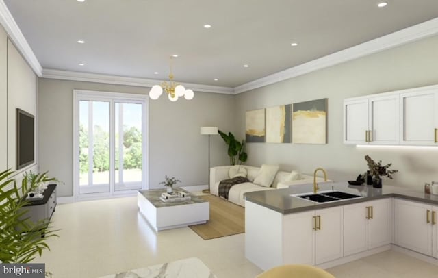 living room featuring sink, a chandelier, and ornamental molding