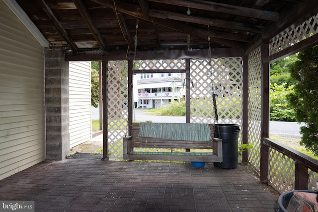 wooden terrace featuring a patio area