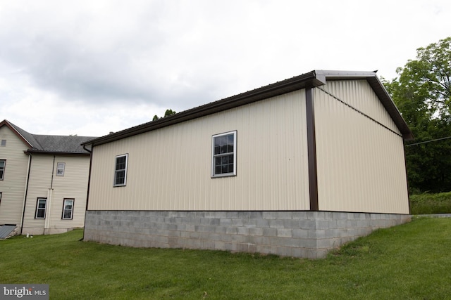 view of side of property with a yard