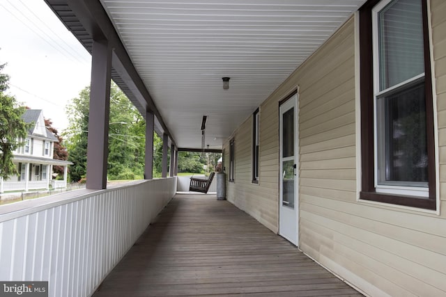 wooden terrace featuring a porch