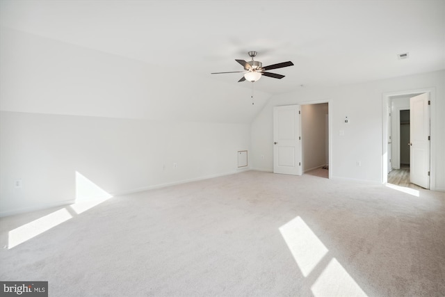 unfurnished room featuring light carpet, ceiling fan, and lofted ceiling