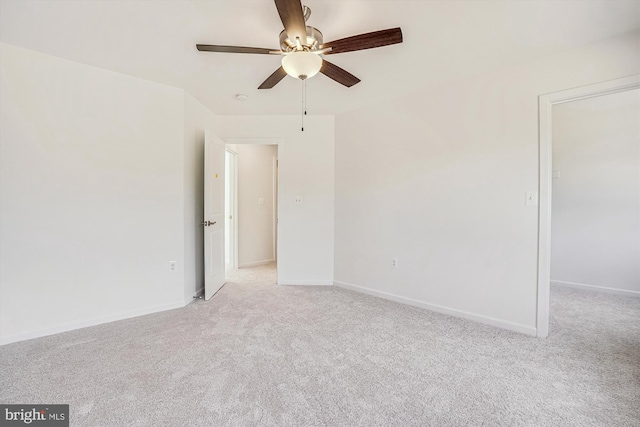 unfurnished room featuring light carpet and ceiling fan