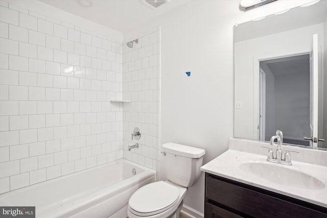 full bathroom featuring vanity, toilet, and tiled shower / bath