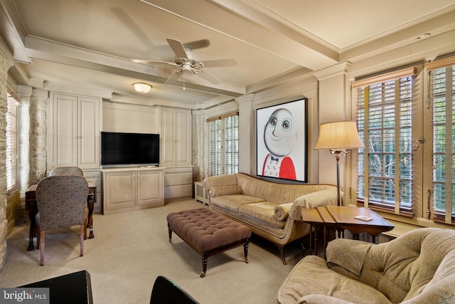 living room featuring ornamental molding, light carpet, ceiling fan, and ornate columns