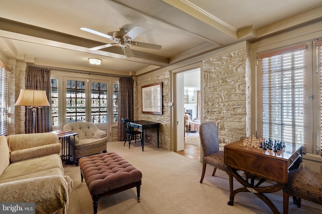 interior space with ceiling fan and crown molding