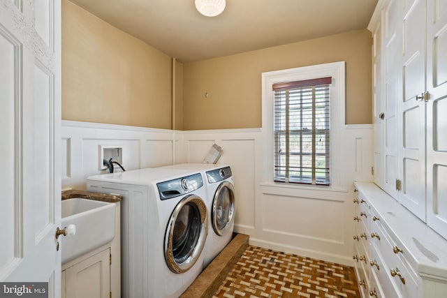 clothes washing area featuring independent washer and dryer, hookup for a washing machine, tile flooring, sink, and cabinets