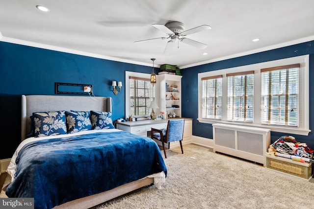 carpeted bedroom featuring ceiling fan, radiator, and ornamental molding