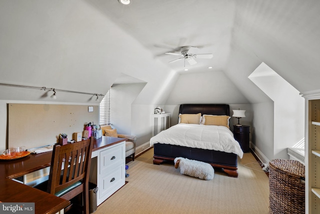 bedroom with light colored carpet, lofted ceiling, and ceiling fan