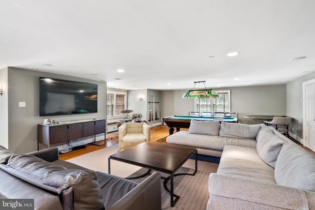 living room with light hardwood / wood-style flooring and billiards