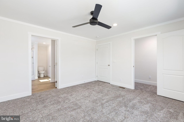 carpeted empty room with ornamental molding and ceiling fan