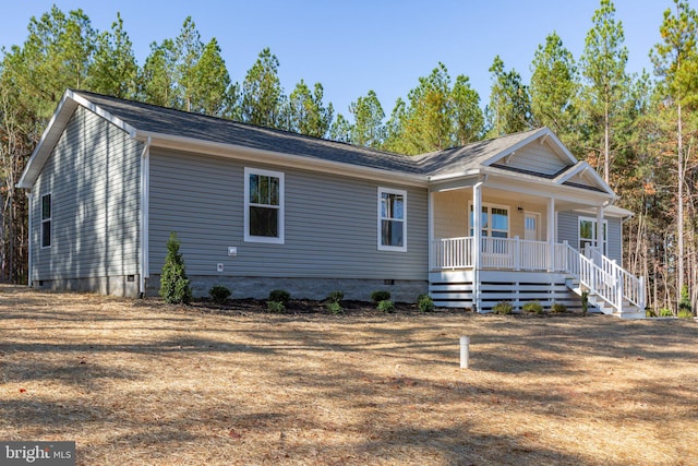 single story home featuring covered porch