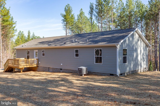 back of house featuring a deck and central AC unit