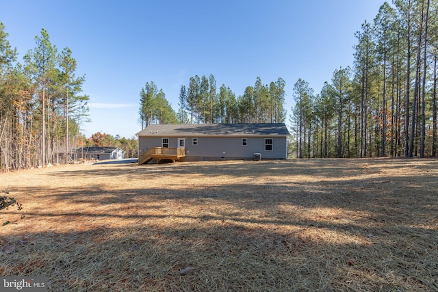 back of property with a deck