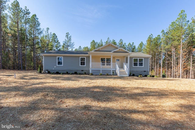 ranch-style home with covered porch