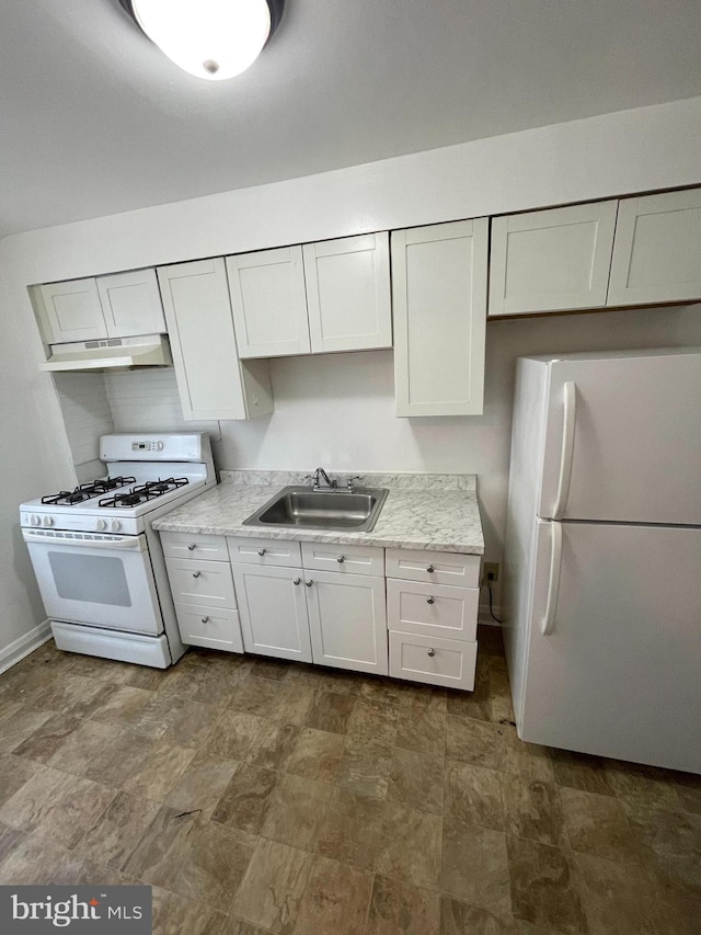 kitchen with white cabinets, white appliances, light stone counters, and sink