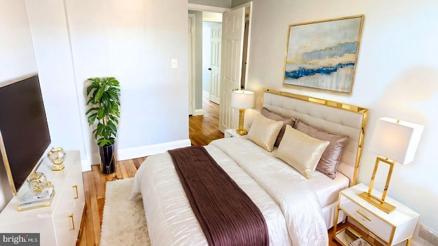 bedroom with light hardwood / wood-style floors