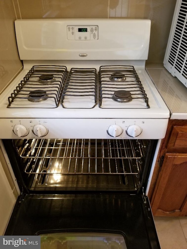 interior details featuring white range with gas stovetop