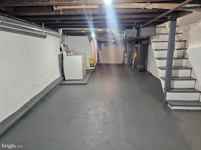 basement featuring washer / clothes dryer and water heater