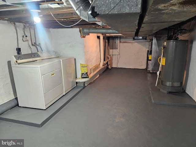 basement with washer and dryer and gas water heater