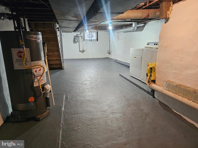 basement with washer and dryer and water heater