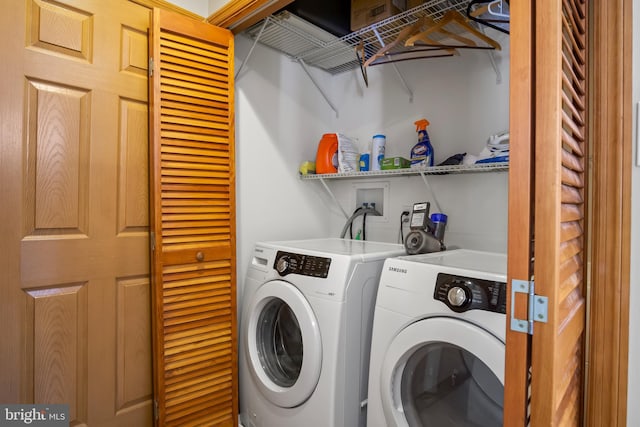 washroom featuring hookup for a washing machine and washing machine and clothes dryer