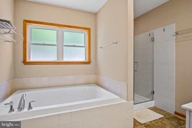 bathroom featuring tile floors and shower with separate bathtub