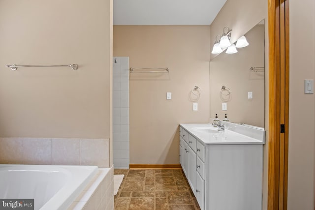 bathroom with oversized vanity, tiled tub, and tile flooring