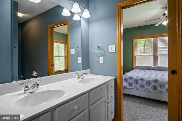 bathroom with plenty of natural light, ceiling fan, and dual vanity