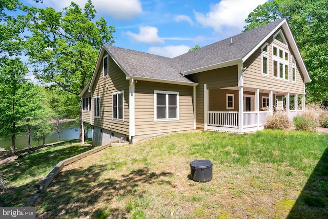 back of house featuring a yard