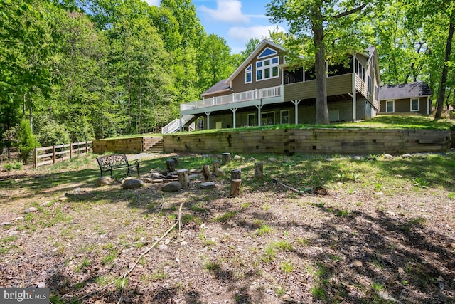 back of property featuring a wooden deck