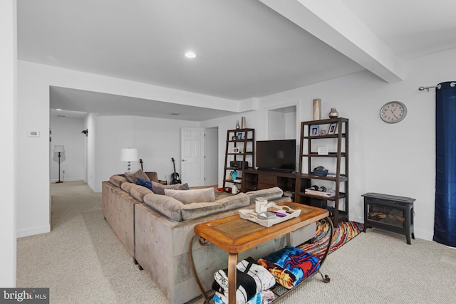 living room featuring light colored carpet, a wood stove, and beamed ceiling