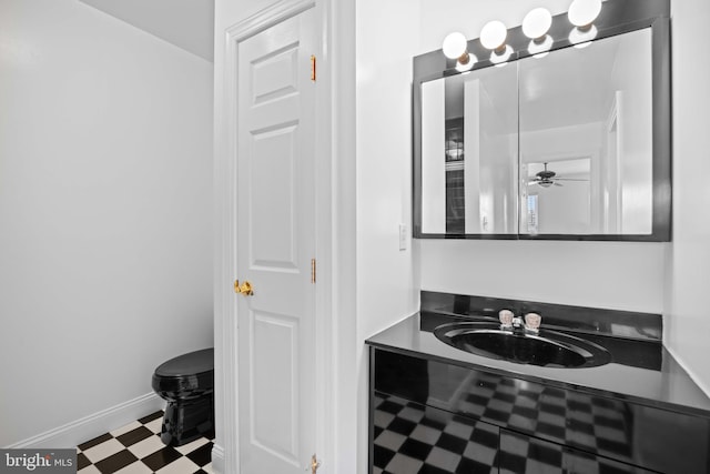 bathroom featuring tile flooring, sink, and ceiling fan