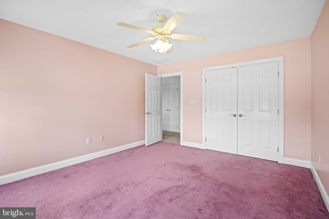 unfurnished bedroom featuring a closet, ceiling fan, and carpet flooring