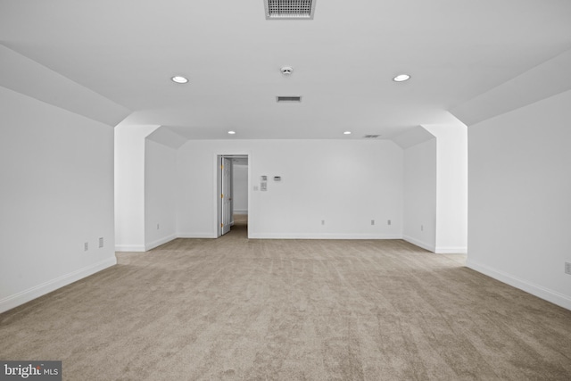 unfurnished room featuring light carpet