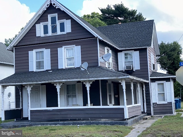 view of front facade featuring cooling unit and covered porch