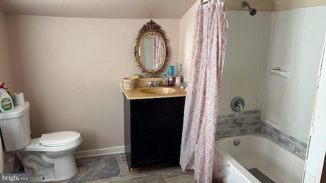 full bathroom featuring vanity, shower / tub combo, and toilet