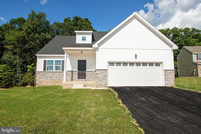 view of front facade with a garage and a front yard