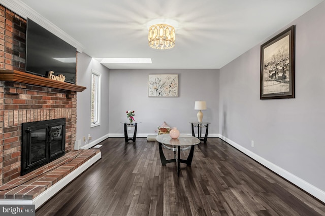 sitting room featuring dark hardwood / wood-style flooring and a fireplace