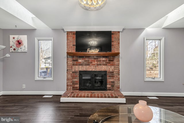 living room featuring dark hardwood / wood-style floors and a fireplace