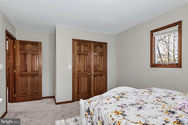 bedroom with carpet floors and a closet